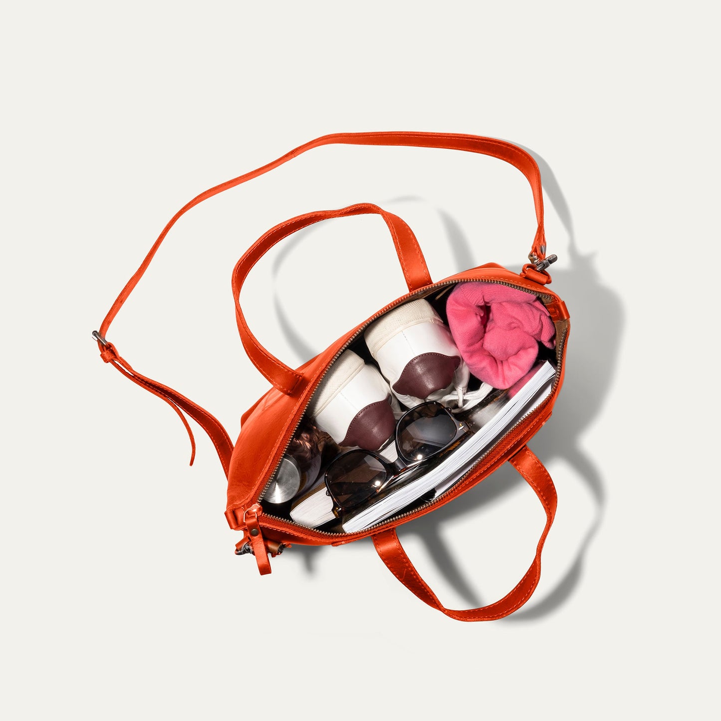 Will Leather Goods Simple Satchel orange bag with adjustable strap, pink scarf inside on Tampa Home & Garden Store