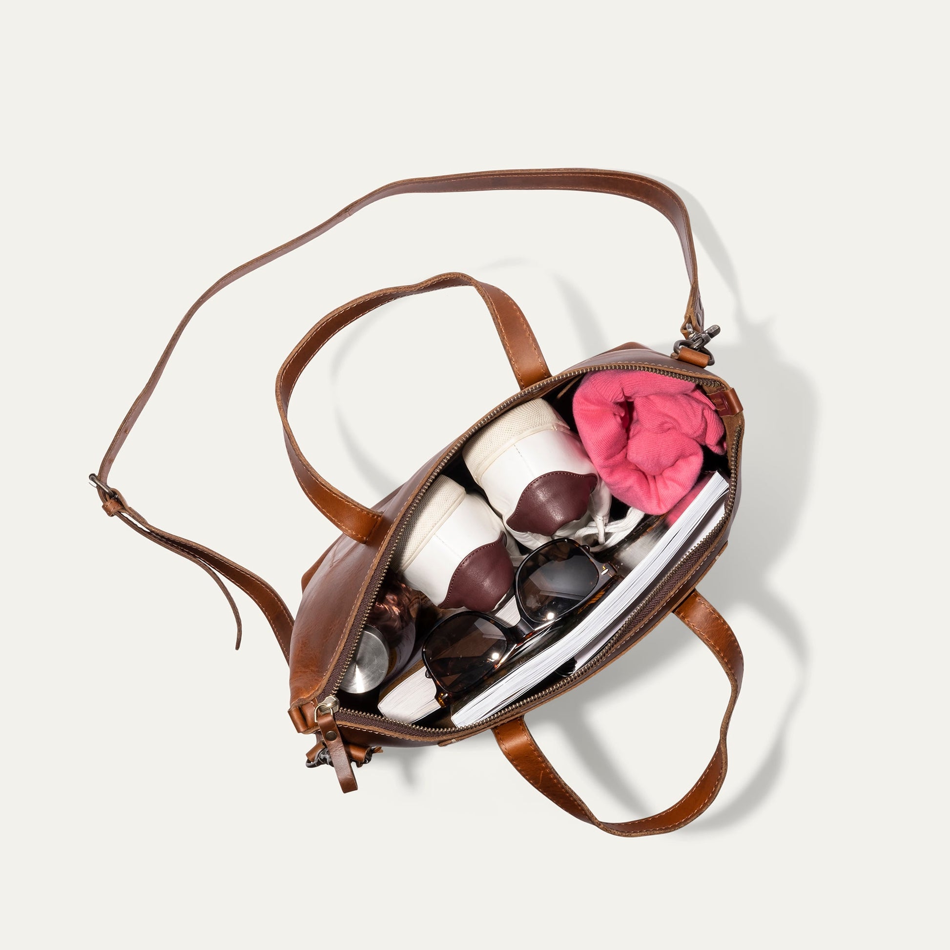 Will Leather Goods Simple Satchel, brown leather bag with strap, pink scarf and sunglasses on Tampa Home & Garden Store