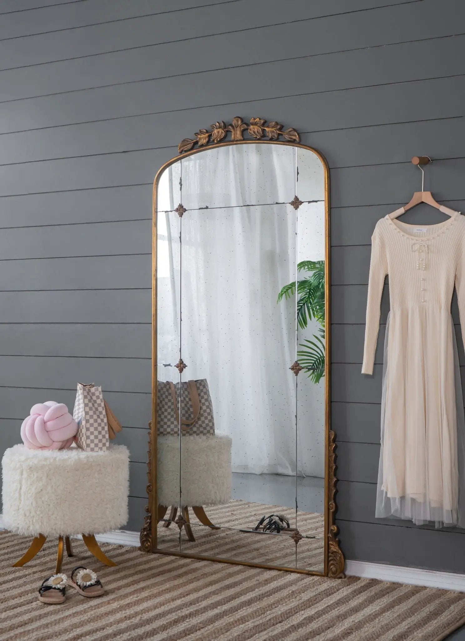 Lavish full-length mirror in antique gold metal with ornate leaf crest, floor-standing on Tampa Home & Garden Store