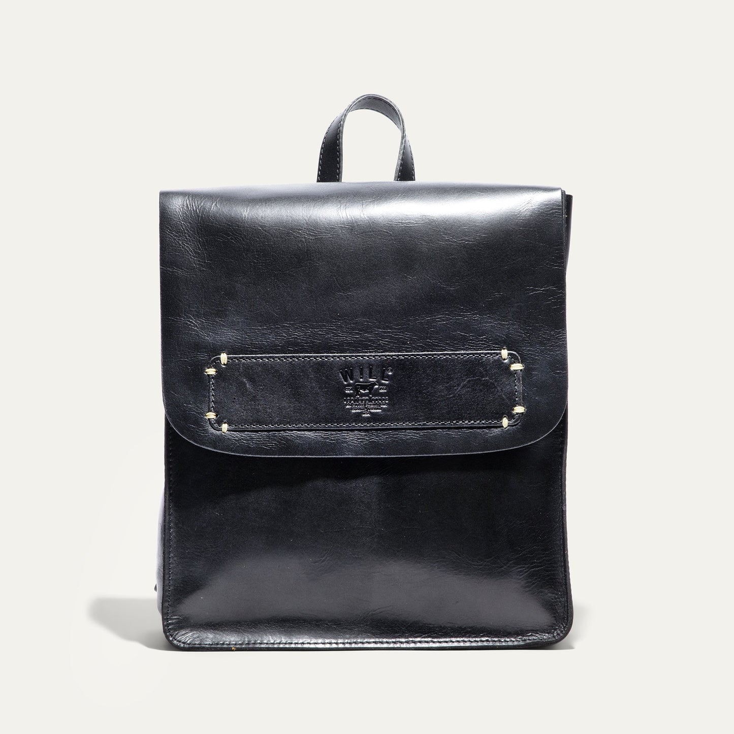 Simple Backpack by Will Leather Goods in black leather with top handle and stitched pocket on Tampa Home & Garden Store