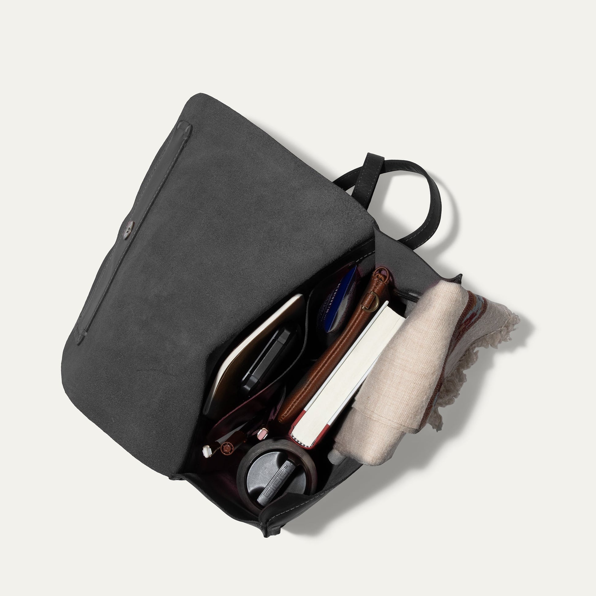 Simple Backpack Will Leather Goods, gray suede with straps, opened with notebooks on Tampa Home & Garden Store