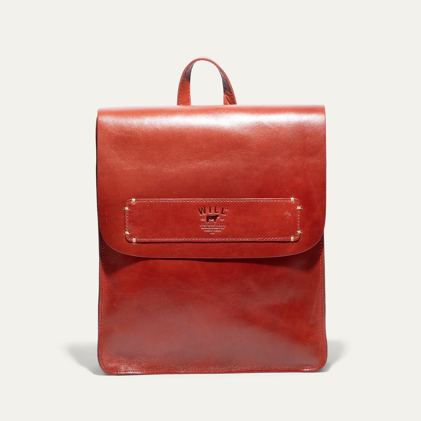 Simple backpack by Will Leather Goods in red leather with front pocket and top handle on Tampa Home & Garden Store