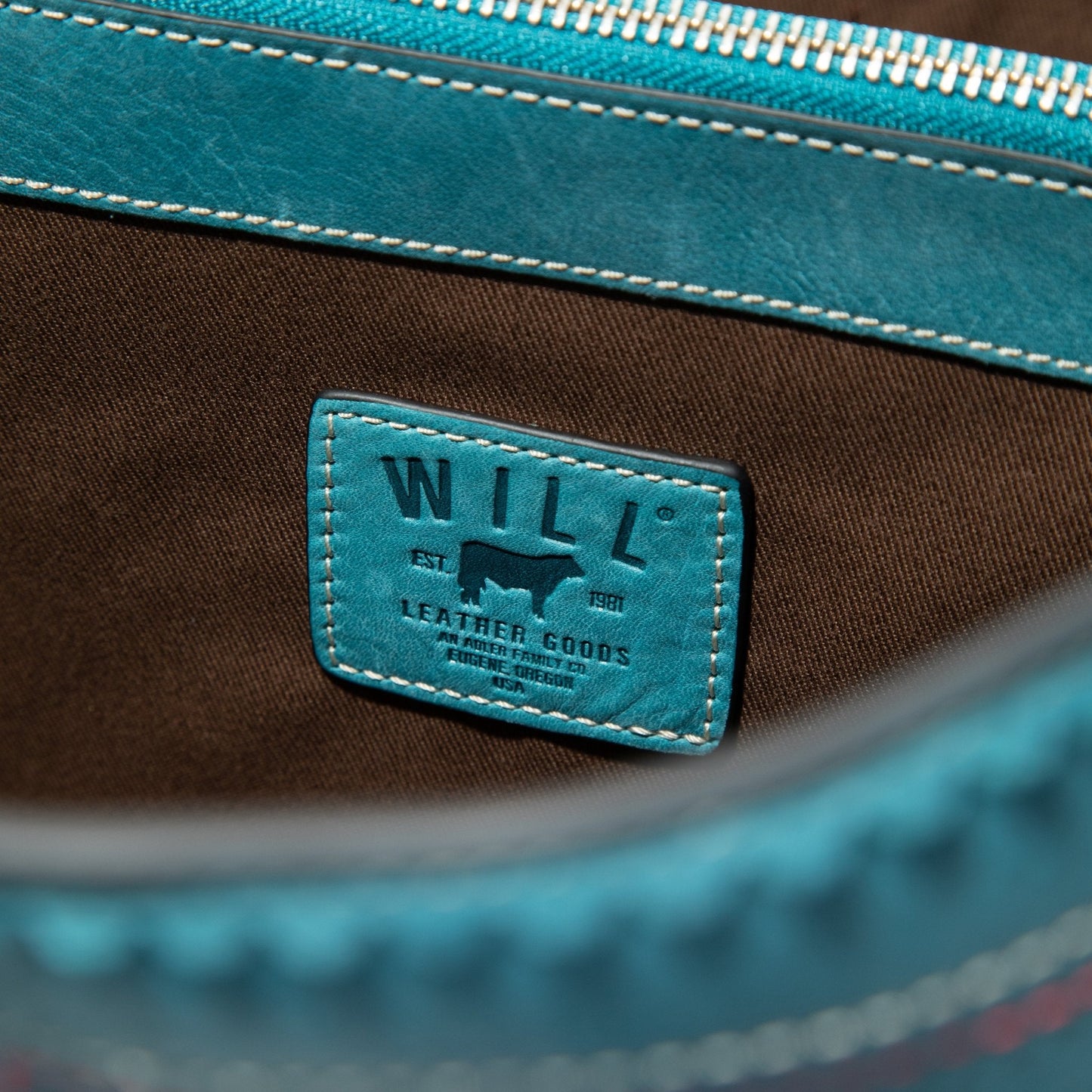 El Paso Work Tote teal leather strap with white stitching and Will Leather Goods patch on Tampa Home & Garden Store