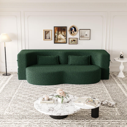 Futon sofa bed in dark green teddy fabric with two foam-filled pillows on Tampa Home & Garden Store