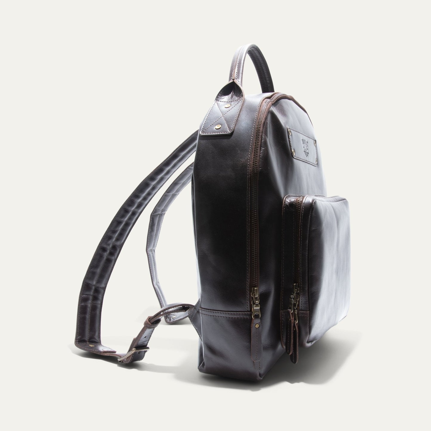The Field Backpack Will Leather Goods dark brown leather with brass zippers on Tampa Home & Garden Store