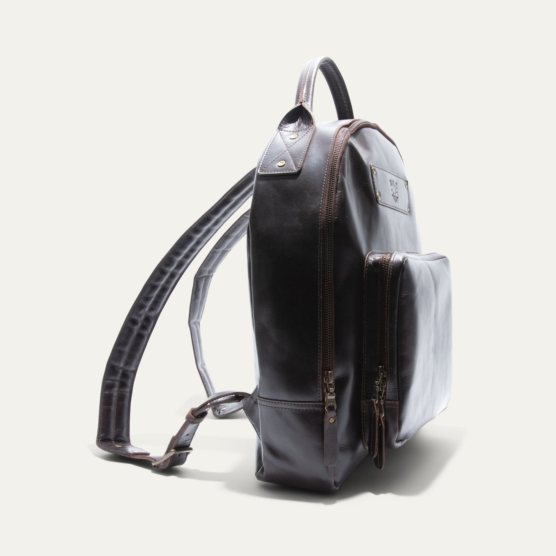 The Field Backpack Will Leather Goods dark brown leather with brass zippers on Tampa Home & Garden Store