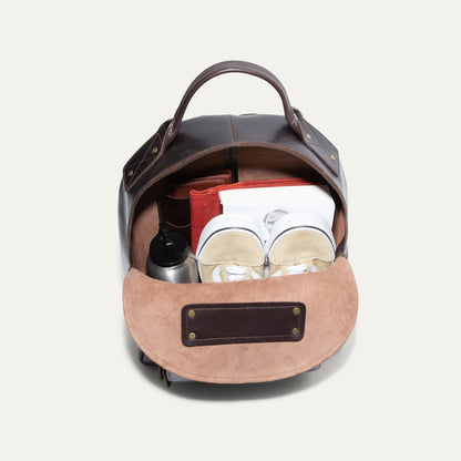 The Field Backpack by Will Leather Goods, open to reveal notebook sneakers water bottle on Tampa Home & Garden Store