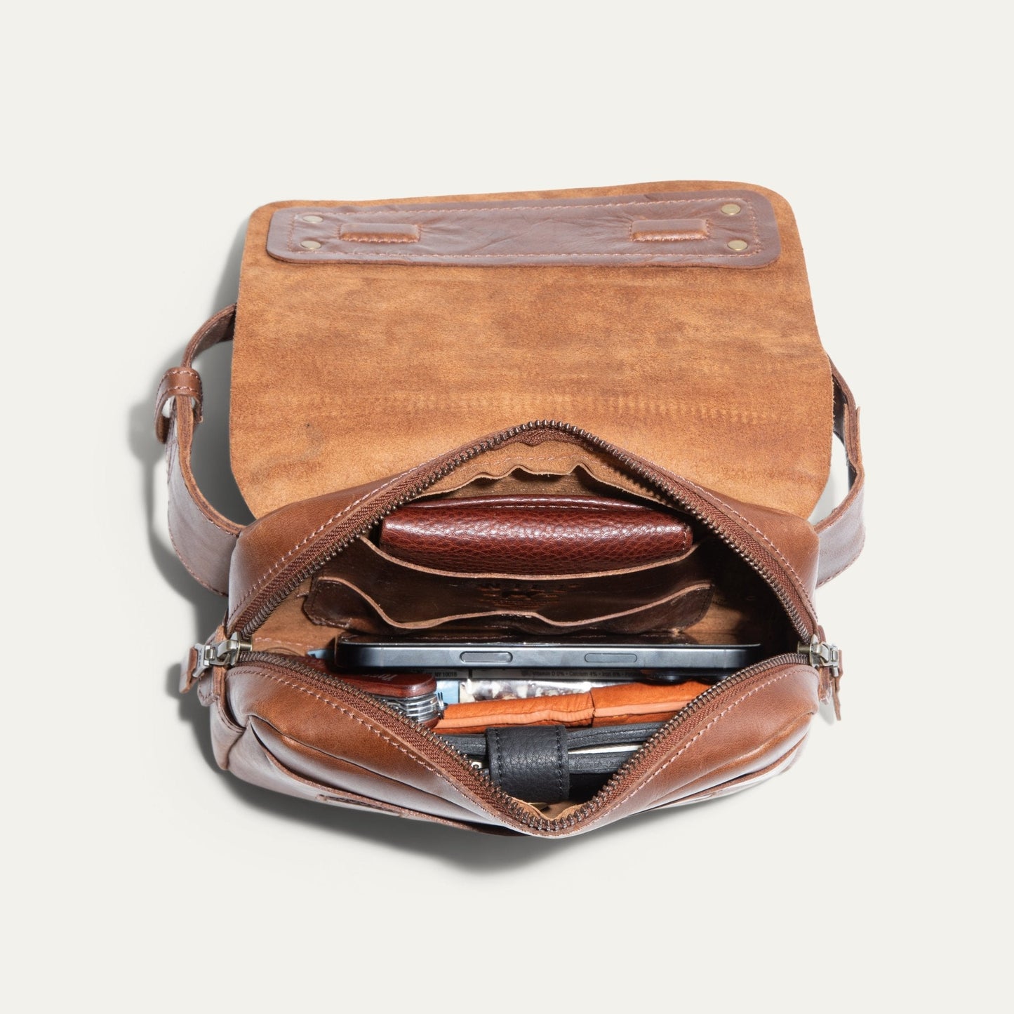 The Field Belt Bag fanny pack in tan suede leather with brass rivet hardware on Tampa Home & Garden Store