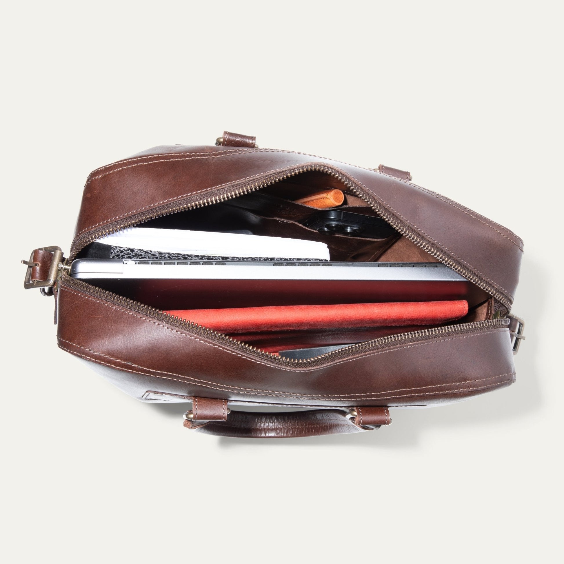 The Field Briefcase brown leather with open zipper, laptop inside on Tampa Home & Garden Store