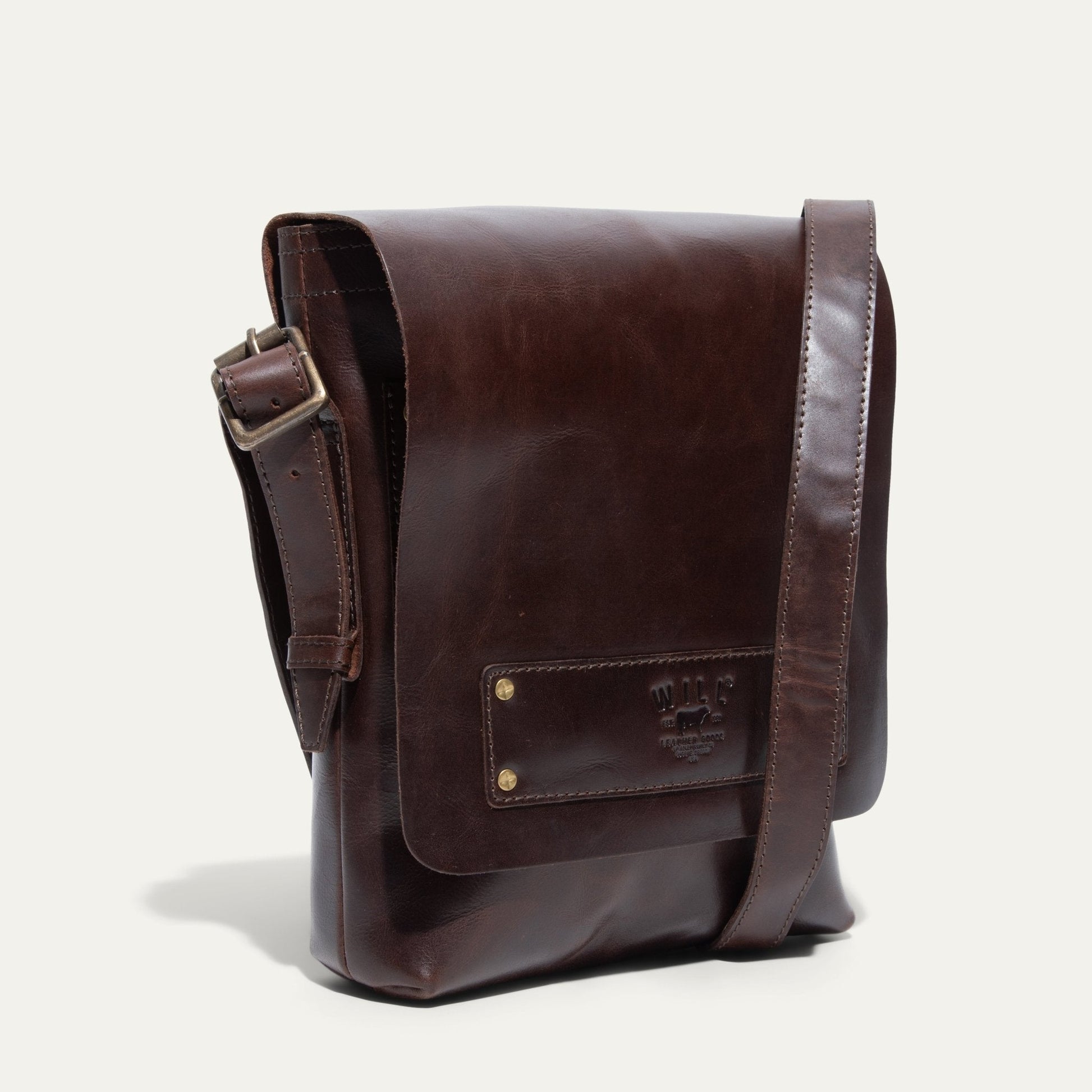 The Field Crossbody bag by Will Leather Goods in dark brown leather with brass buckle strap on Tampa Home & Garden Store