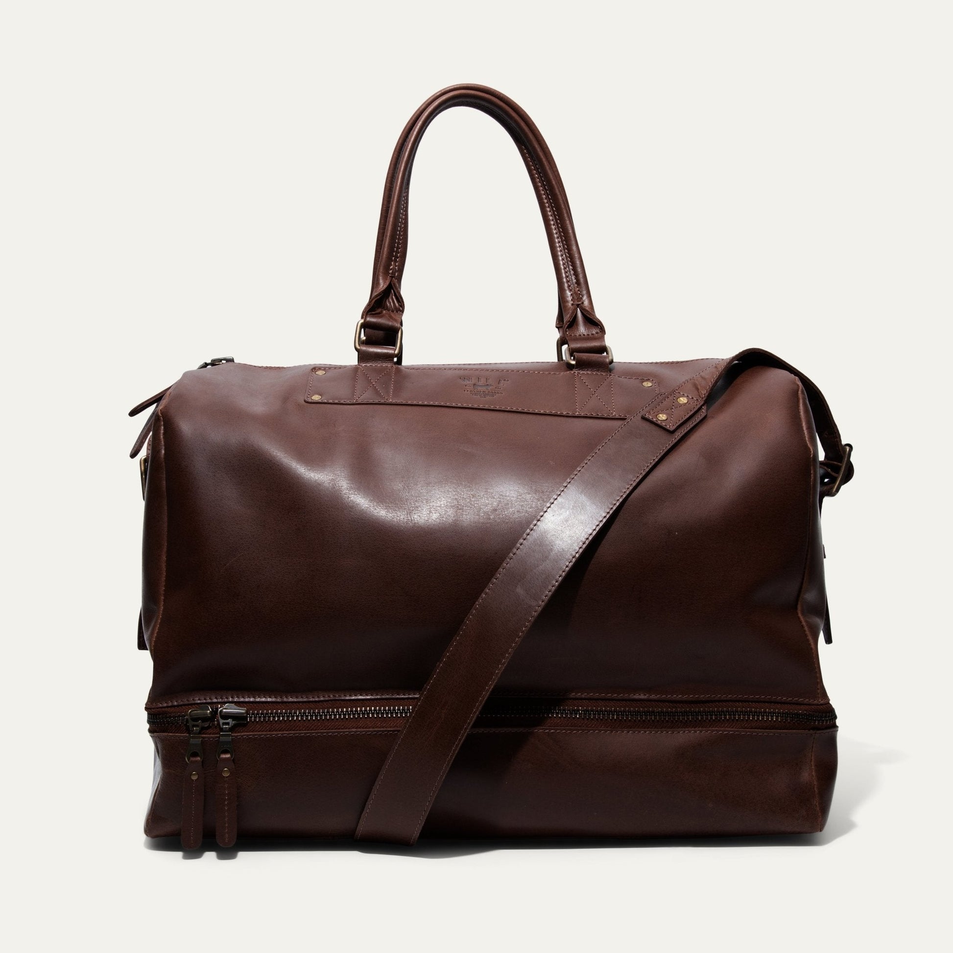 The Field Duffle by Will Leather Goods brown leather duffel bag with top handles and strap on Tampa Home & Garden Store
