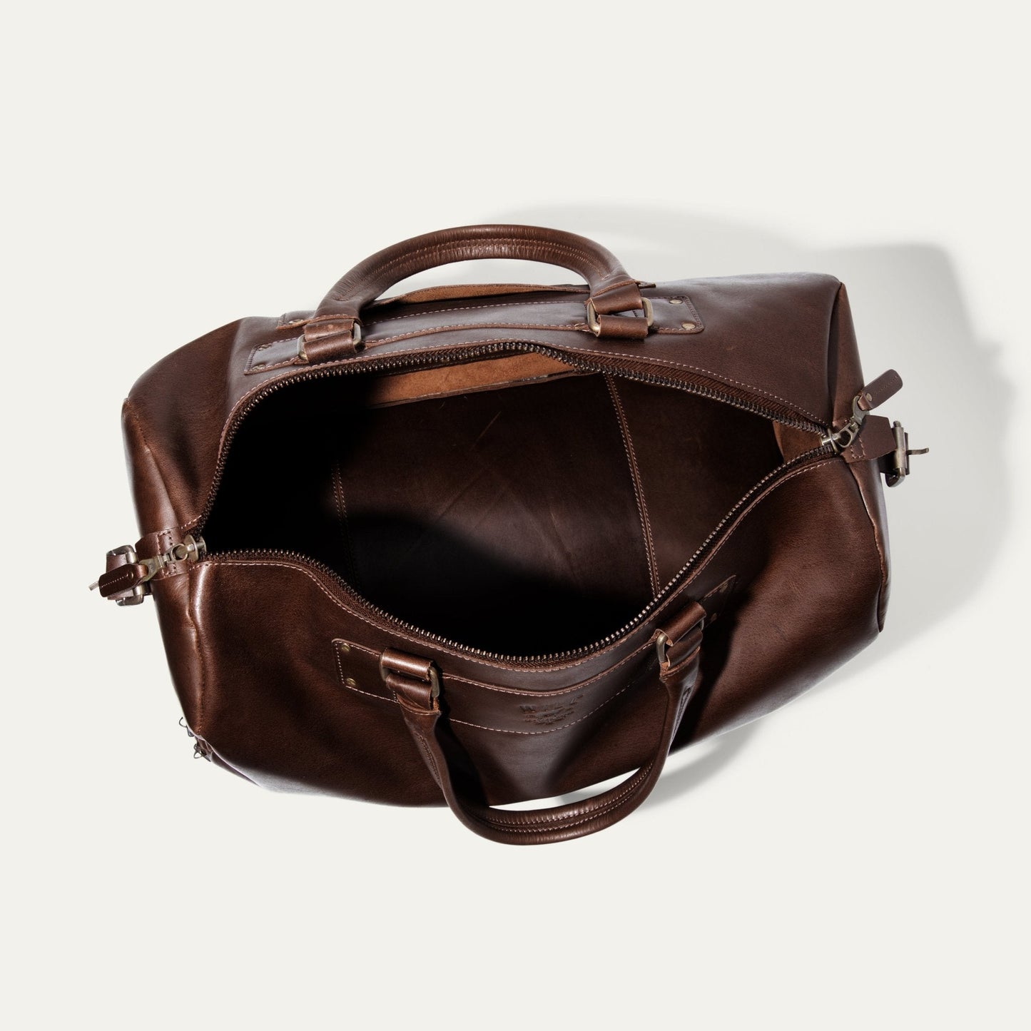 The Field Duffle bag by Will Leather Goods in brown leather with sturdy top handles on Tampa Home & Garden Store
