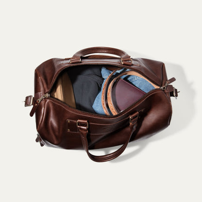 The Field Duffle brown leather bag by Will Leather Goods, open with denim inside on Tampa Home & Garden Store