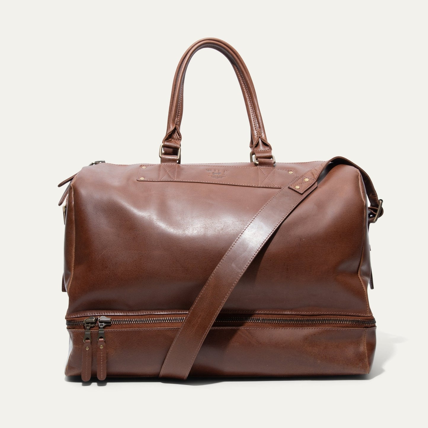 The Field Duffle by Will Leather Goods brown leather duffel bag with handles and crossbody strap on Tampa Home & Garden Store