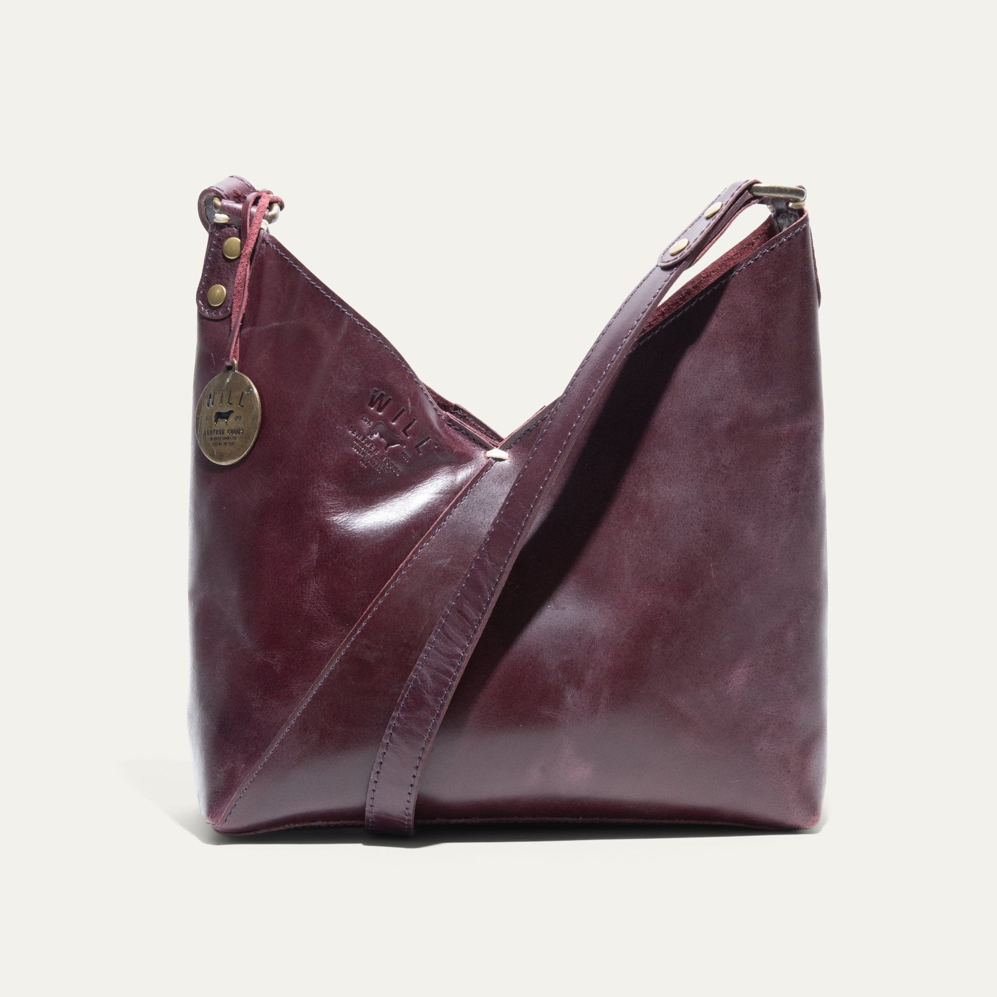 Simple Mini V Hobo bag by Will Leather Goods in burgundy leather with brass rivets and logo tag on Tampa Home & Garden Store