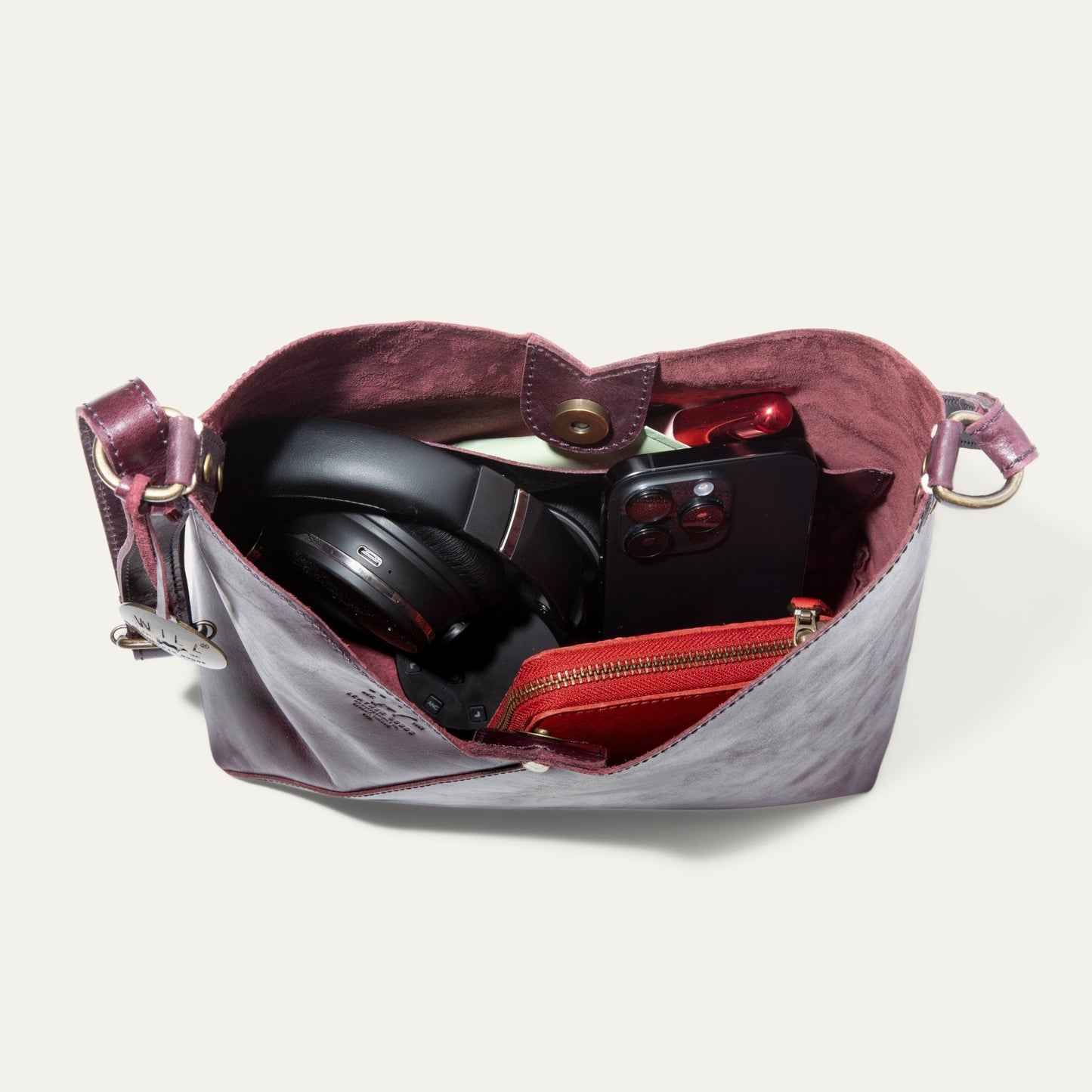 Will Leather Goods Simple Mini V Hobo burgundy leather bag open with camera gear inside on Tampa Home & Garden Store