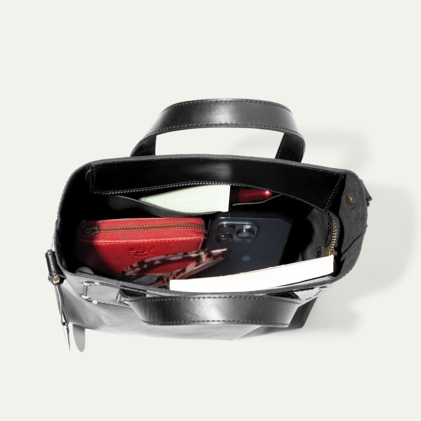 Simple Mini Satchel by Will Leather Goods, black leather with red interior, open view with phone inside on Tampa Home & Garden Store