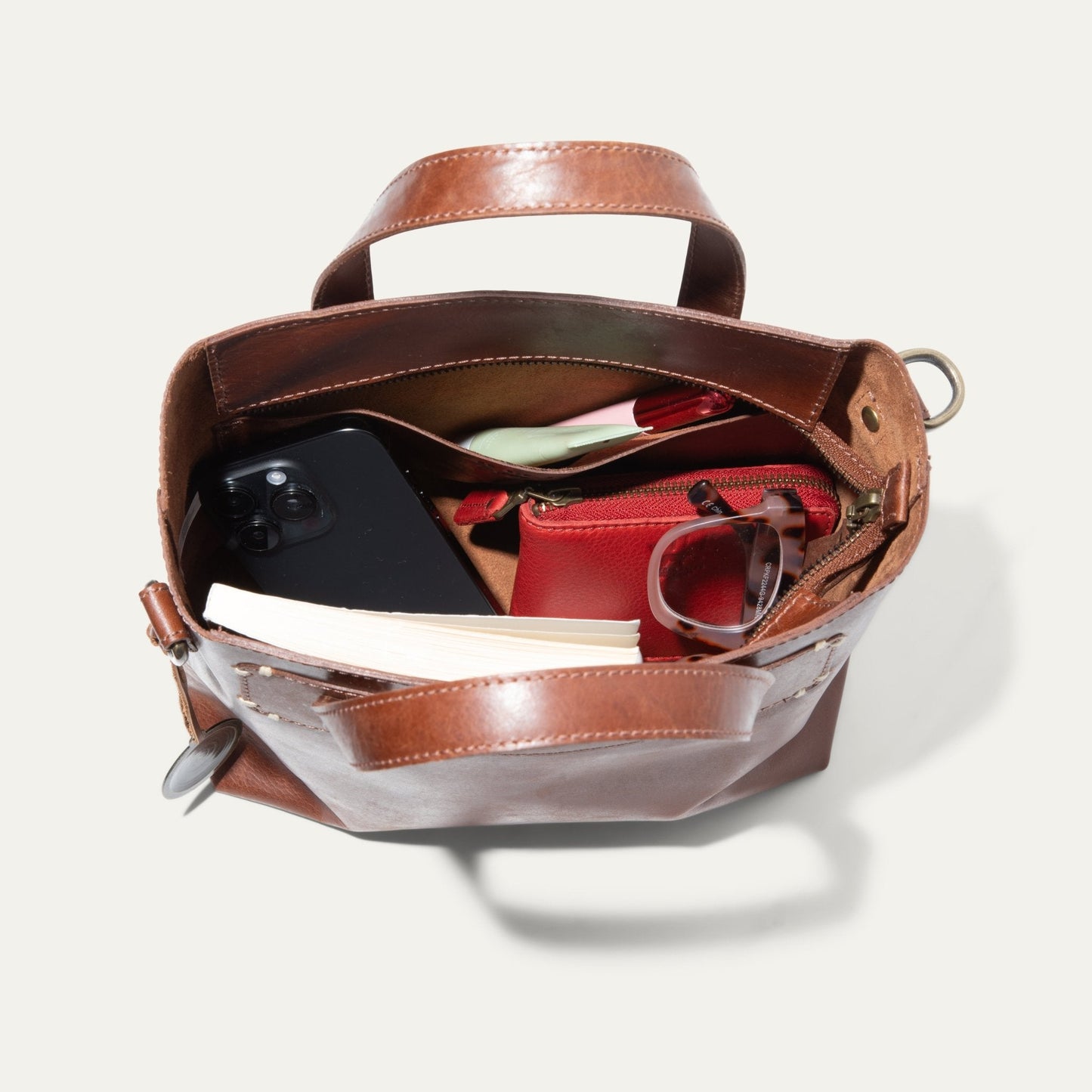 Simple Mini Satchel by Will Leather Goods brown leather bag open with phone and sunglasses on Tampa Home & Garden Store