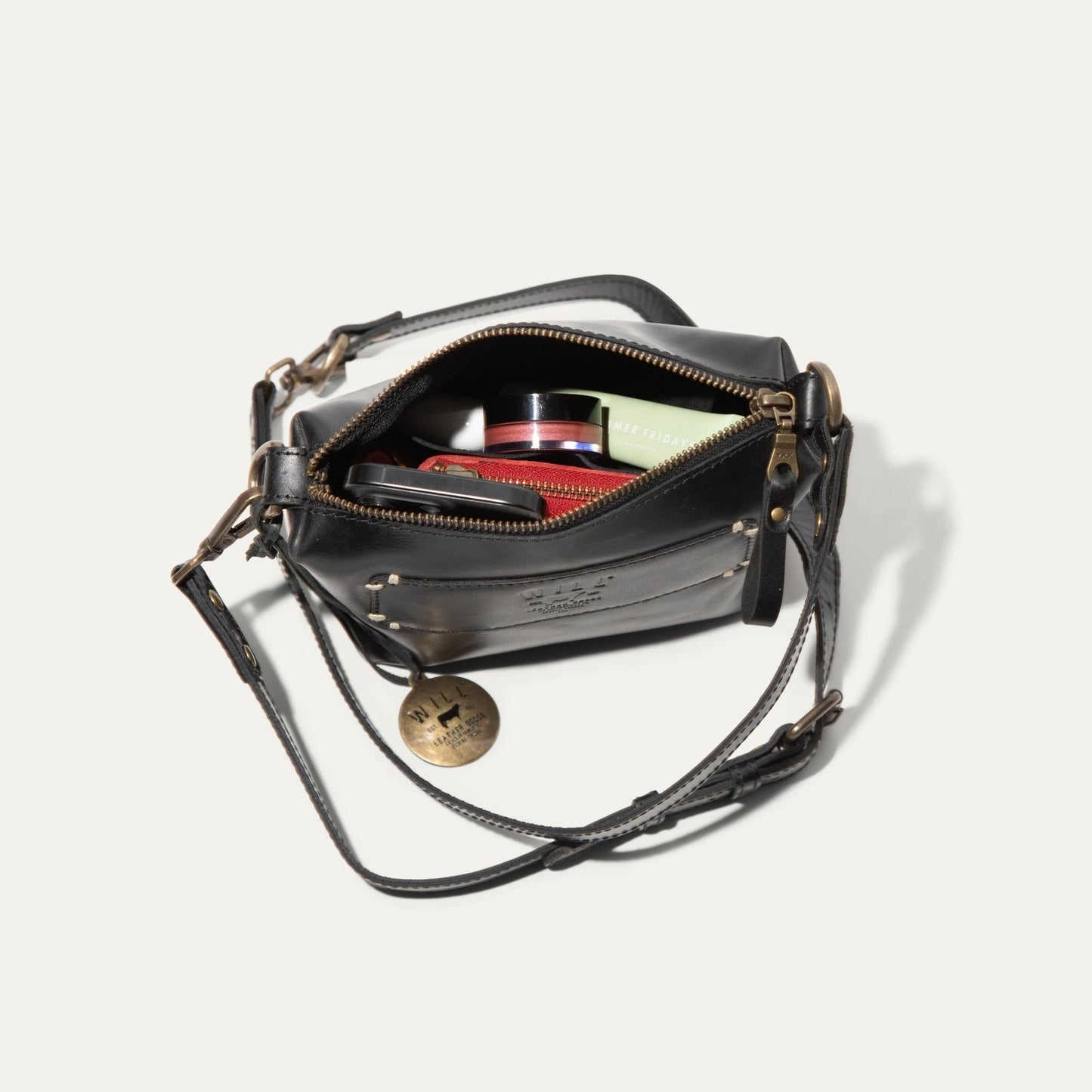 Will Leather Goods Simple Mini Pouch black leather shoulder bag, open with contents visible on Tampa Home & Garden Store