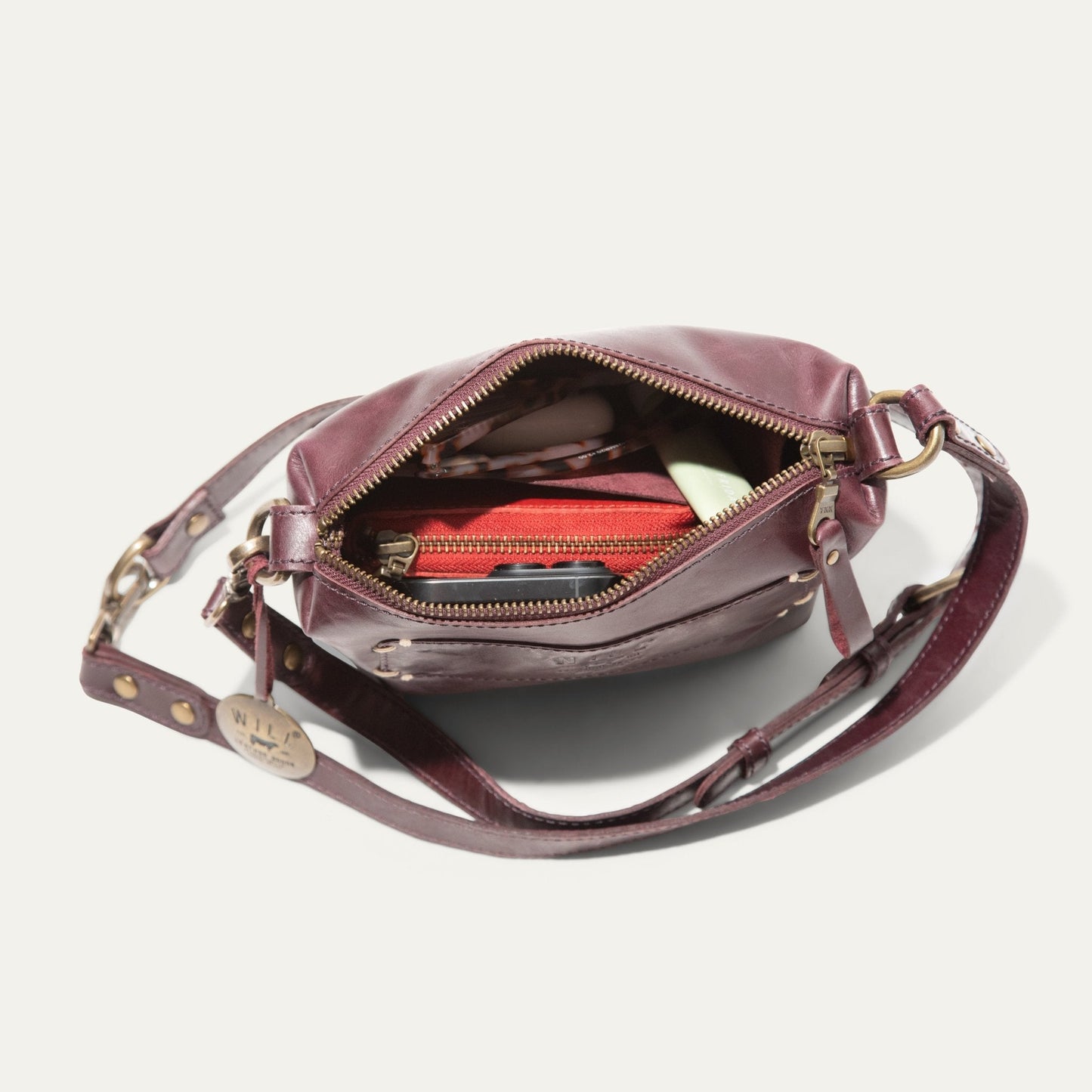 Simple Mini Pouch shoulder bag by Will Leather Goods in burgundy leather with brass hardware on Tampa Home & Garden Store