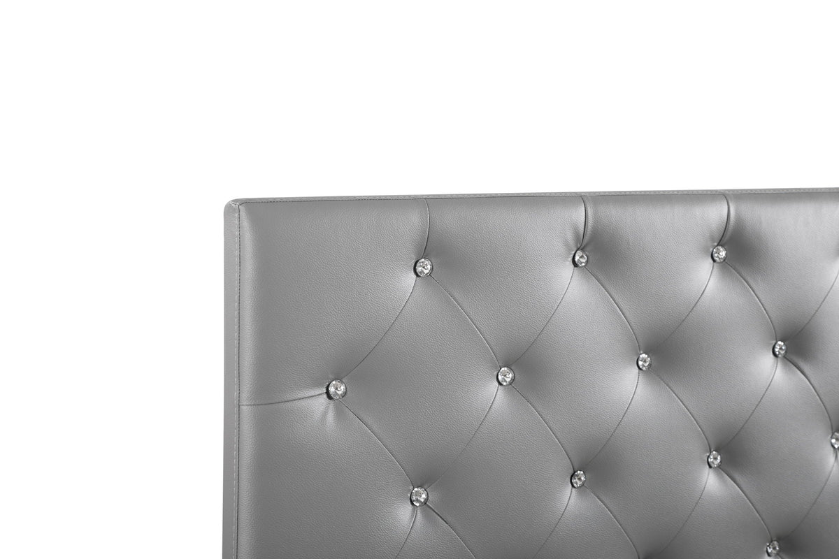 Upholstered headboard with gray faux leather button tufting and crystal accents on Tampa Home & Garden Store
