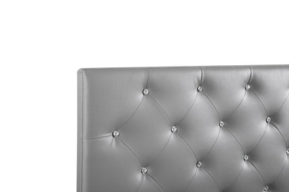 Upholstered headboard with gray faux leather button tufting and crystal accents on Tampa Home & Garden Store