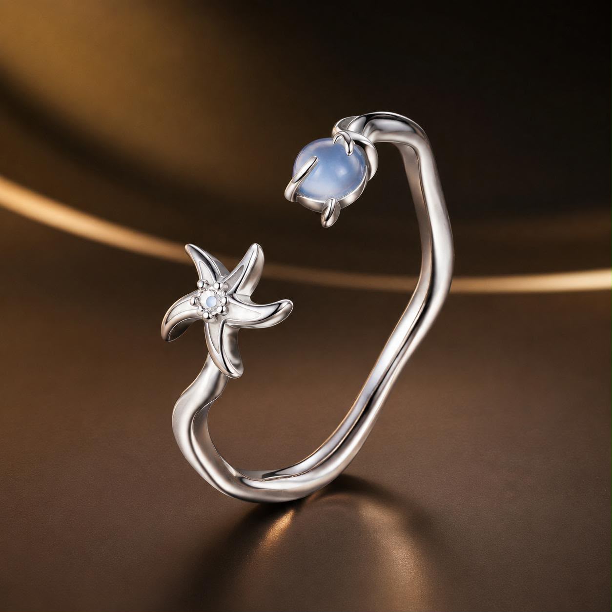 Sterling silver ring with white gold plating, open wrap with blue cabochon and starfish accent on Tampa Home & Garden Store