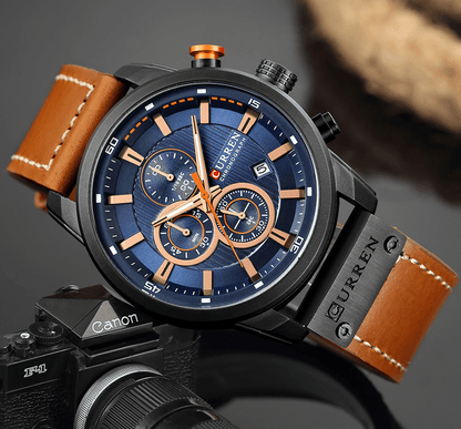 Men's Curren chronograph sport watch with blue dial, rose-gold accents, brown leather strap on Tampa Home & Garden Store