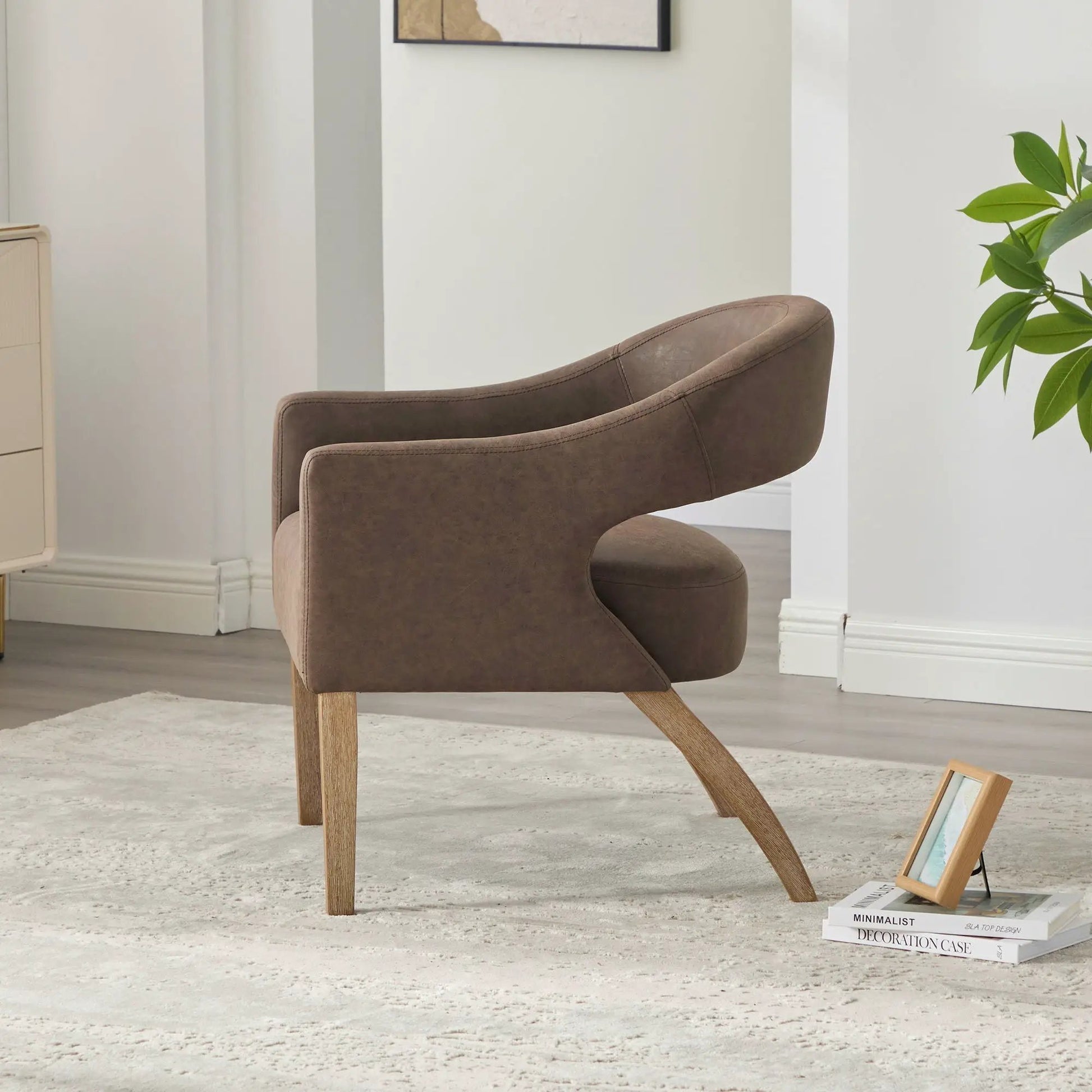 Upholstered open-back armchair with weathered rubberwood legs in brown faux leather on Tampa Home & Garden Store