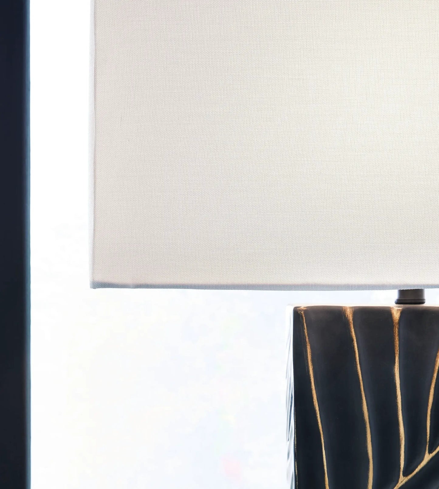 Bartlen Poly Table Lamp in Black and Gold Finish