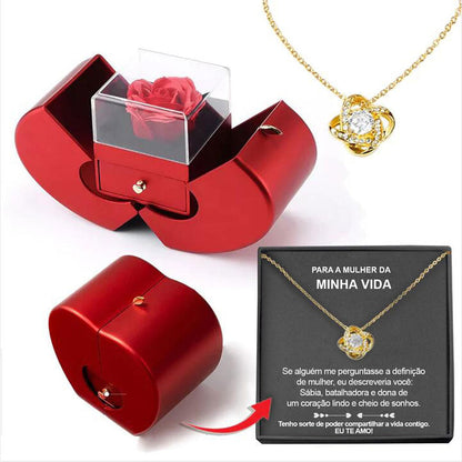 Red apple jewelry box with lid housing a red artificial rose and a gold necklace pendant on Tampa Home & Garden Store