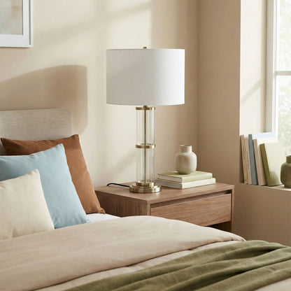 Echo table lamp with clear glass body, brass accents, and white shade on Tampa Home & Garden Store