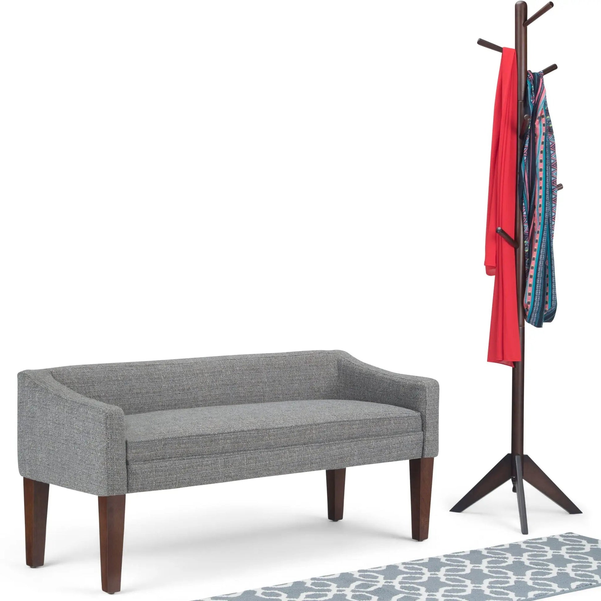 Parris Contemporary Upholstered Bench gray fabric with dark wood legs beside a coat rack on Tampa Home & Garden Store