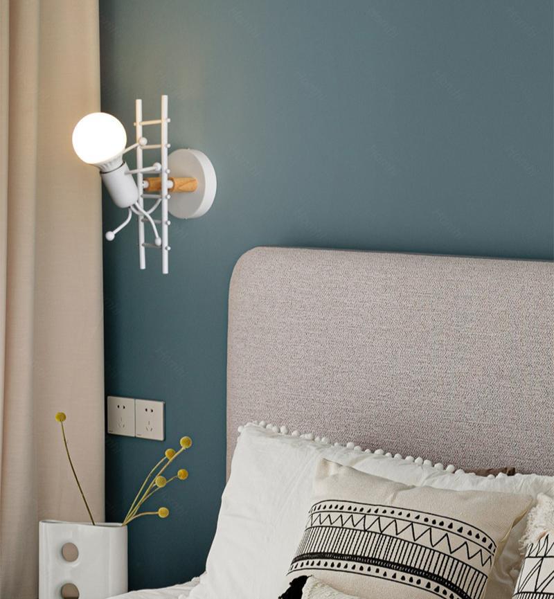 Stevvex wall light ST10LM1584DEW modern retro cartoon doll sconce beside bed on teal wall on Tampa Home & Garden Store