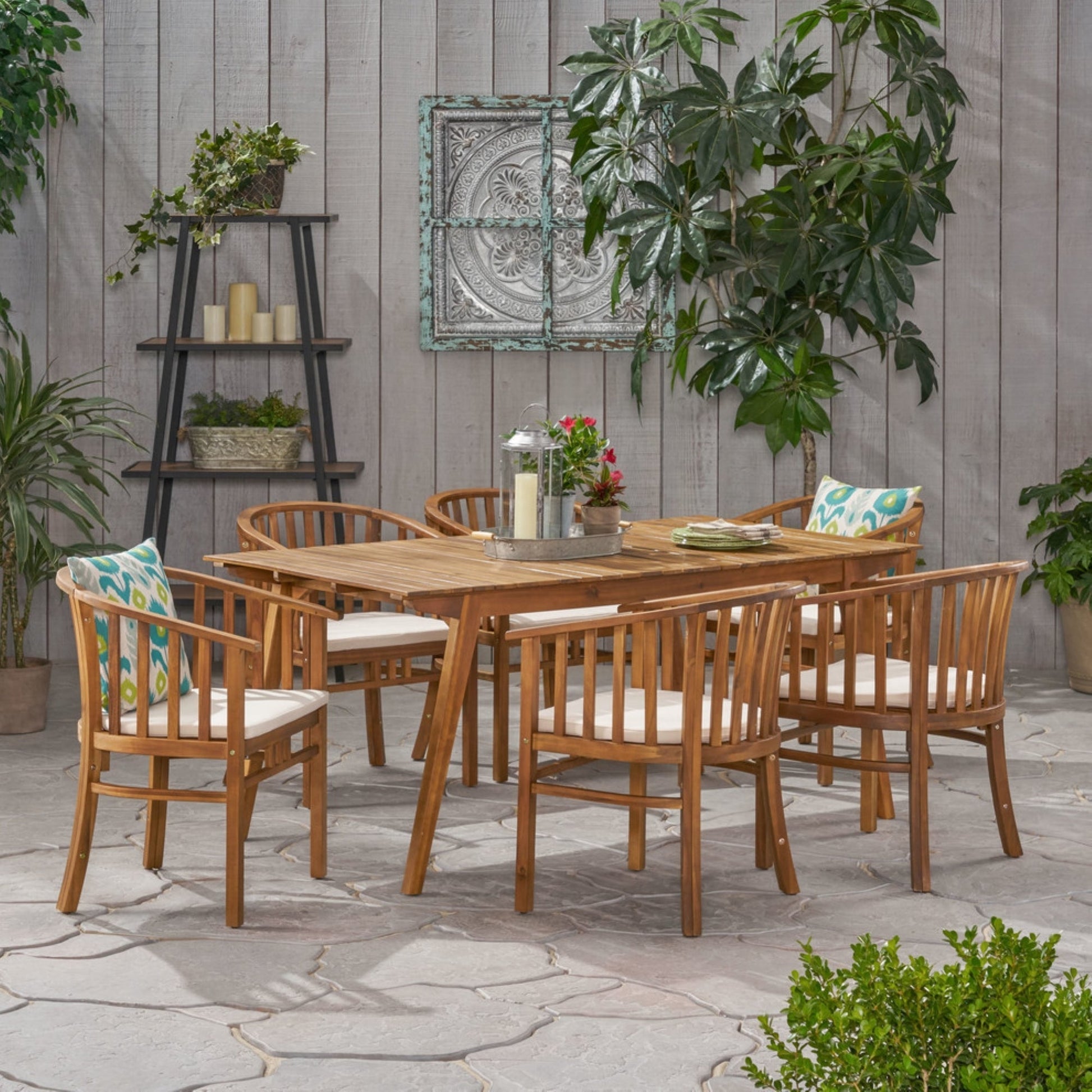 Outdoor 6-seat acacia wood dining set with teak finish and cream cushions on Tampa Home & Garden Store
