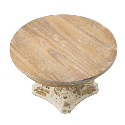 Cake stand round brown wood cake plate atop a cream magnesium base pedestal on Tampa Home & Garden Store