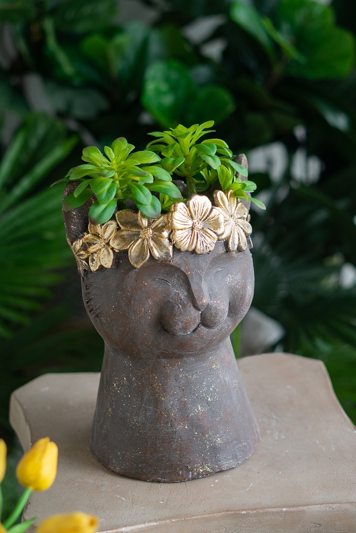 Magnesium cat statue planter with textured finish and gold floral crown, holds green succulent on Tampa Home & Garden Store