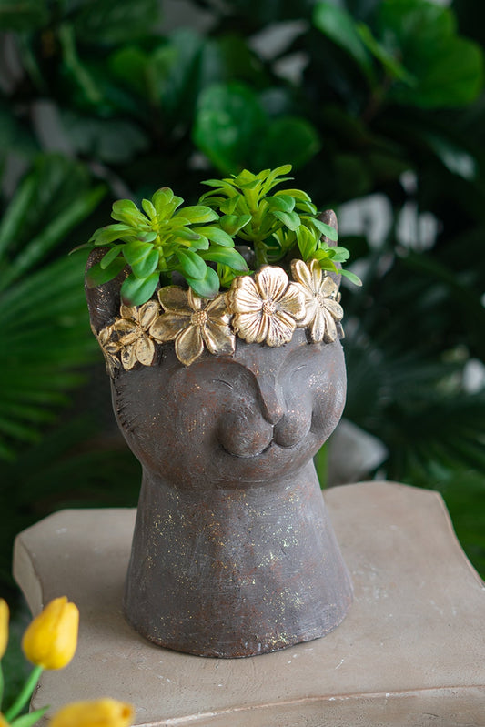 Magnesium cat statue planter with textured finish and gold floral crown, holds green succulent on Tampa Home & Garden Store