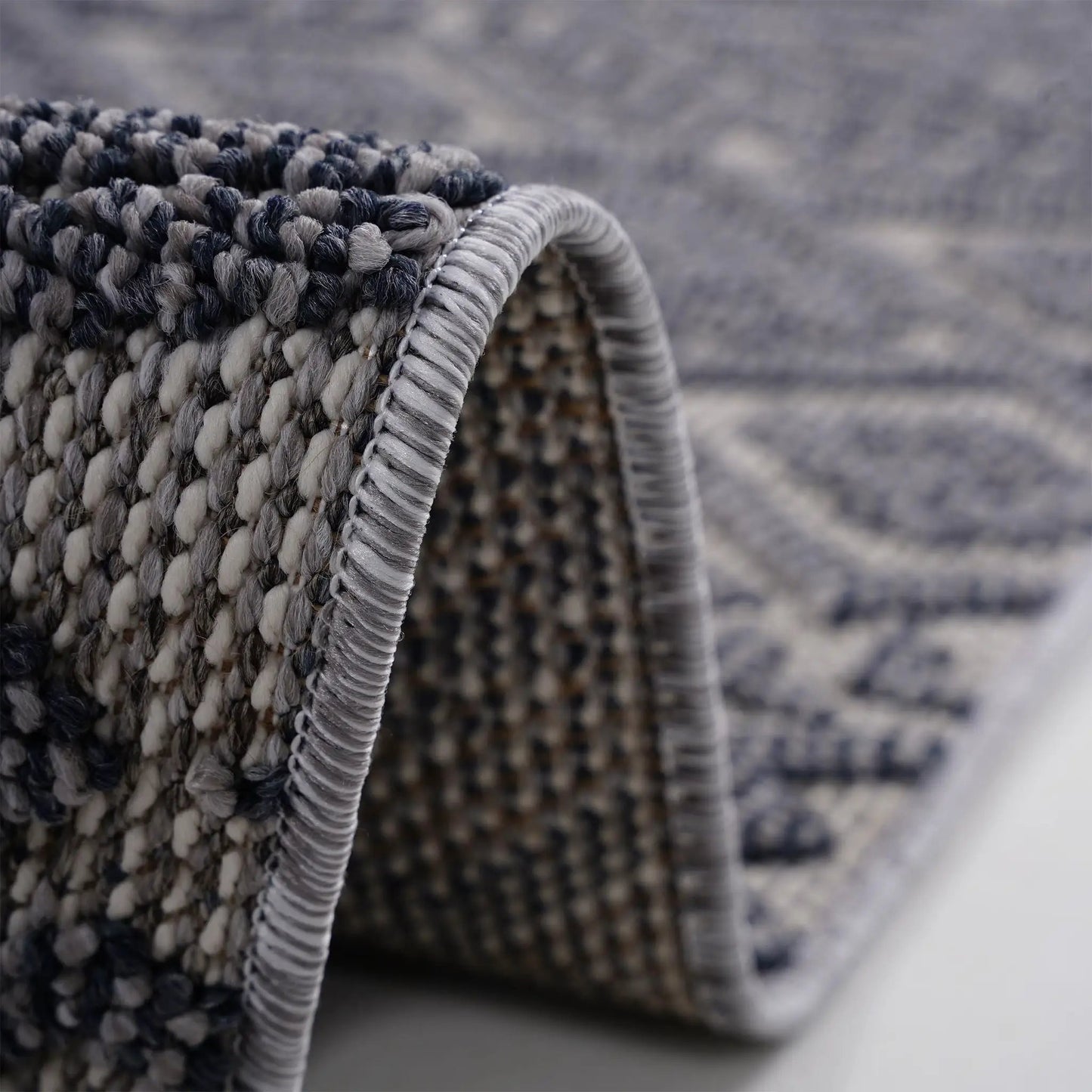 Guros Indoor/Outdoor Area Rug with gray and black braided texture by Unique Piece Furniture on Tampa Home & Garden Store