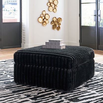 Round black velvet ottoman from Midnight-Madness 4 Piece Set with stacked gray boxes and gold art on Tampa Home & Garden Store