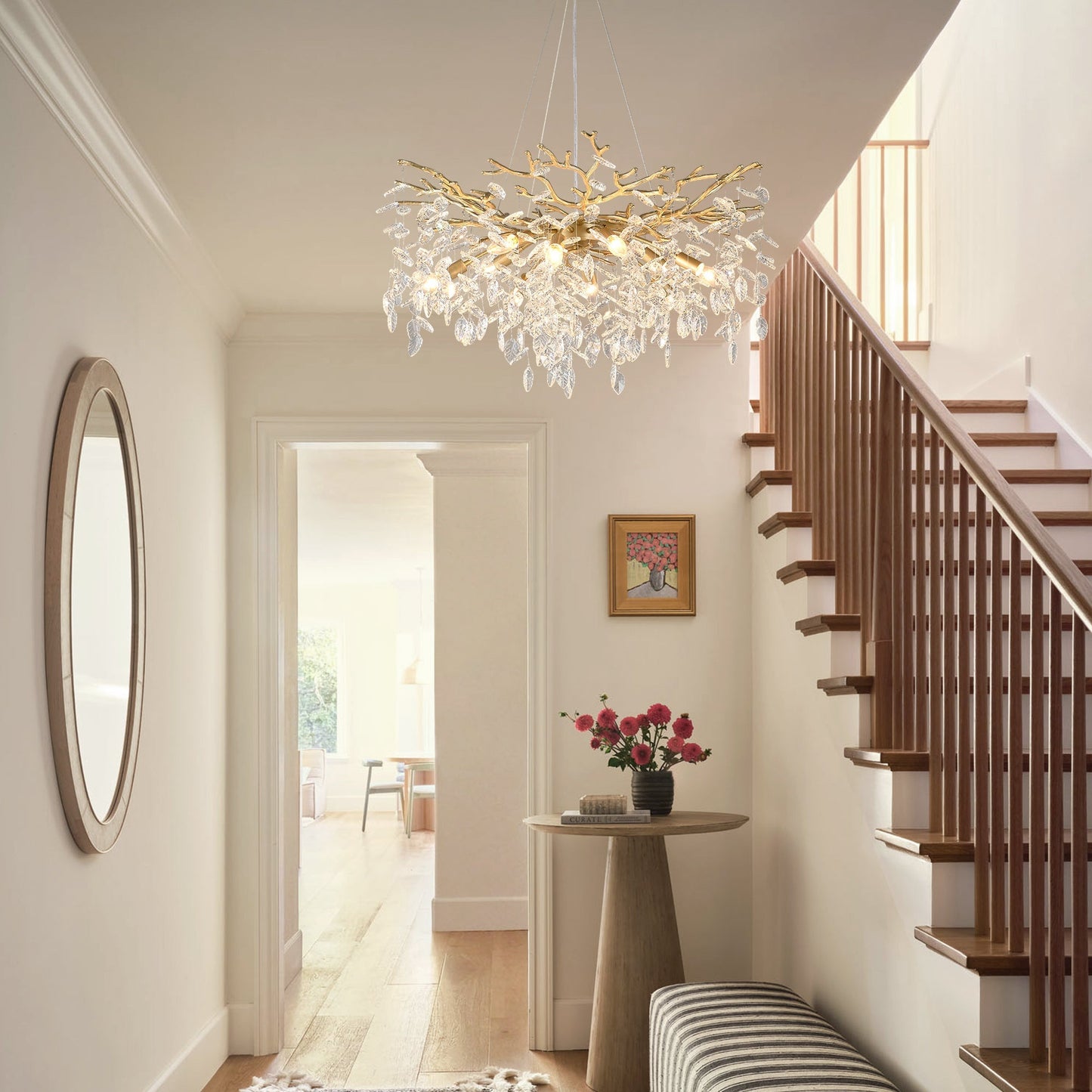 8-Light Crystal Gold Chandelier with crystal droplets and gold branches in a hallway near stairs on Tampa Home & Garden Store