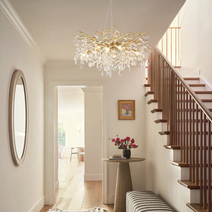 8-Light Crystal Gold Chandelier with crystal droplets and gold branches in a hallway near stairs on Tampa Home & Garden Store