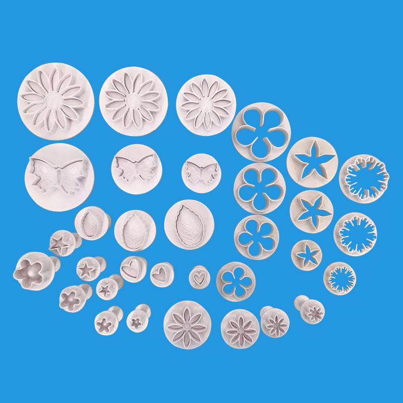Stevvex 33-piece white plastic fondant cutter set with flower, butterfly, star, leaf shapes on Tampa Home & Garden Store