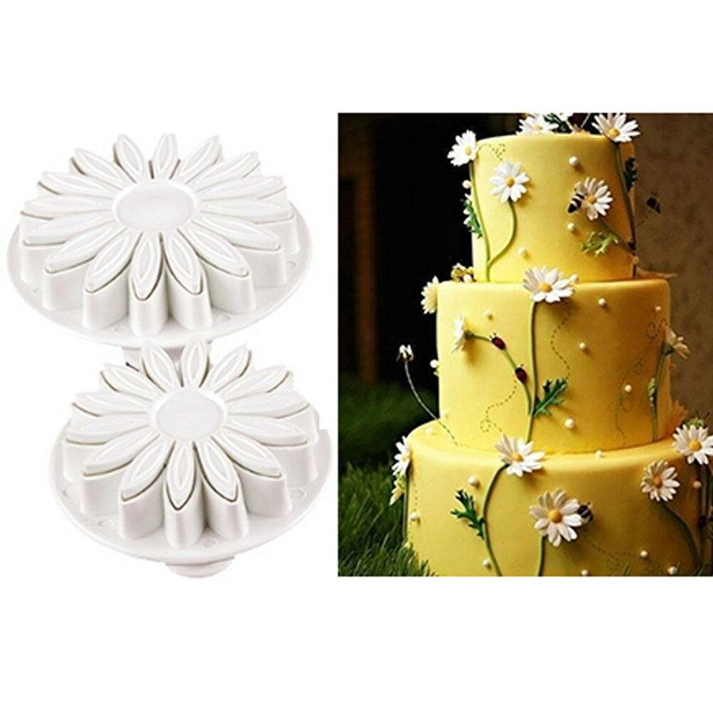 Stevvex fondant daisy cutters (2); white flower cookie molds beside a yellow cake with daisies on Tampa Home & Garden Store