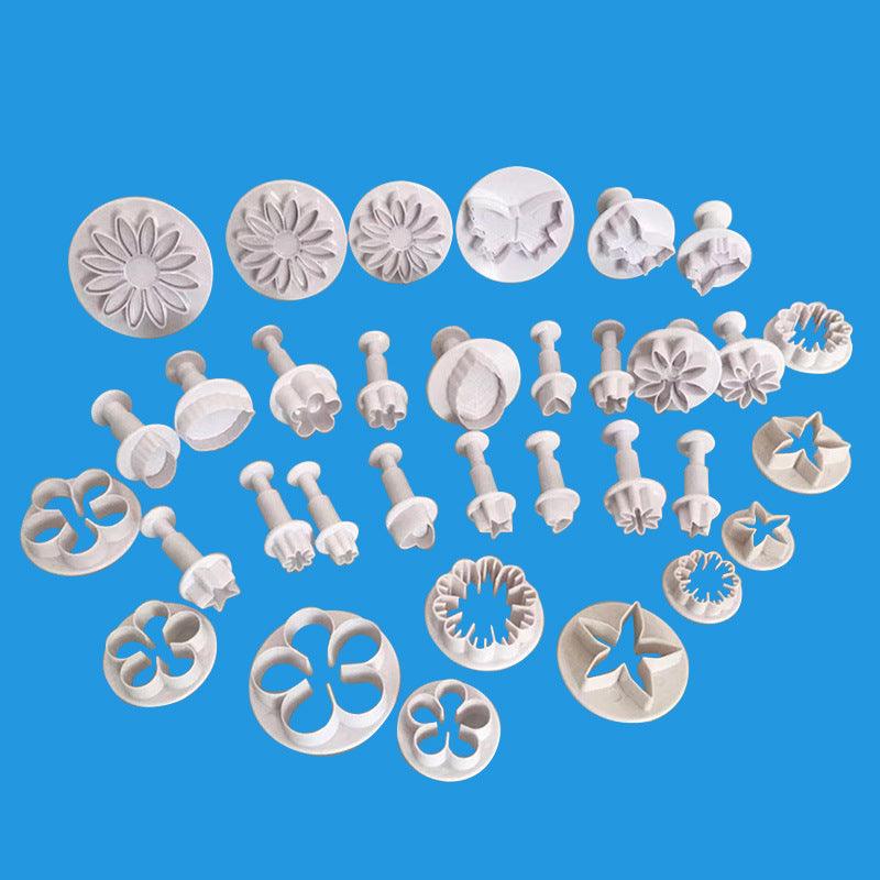 Stevvex 33pc fondant cutter set in white plastic with flower and star molds for cake decorating on Tampa Home & Garden Store
