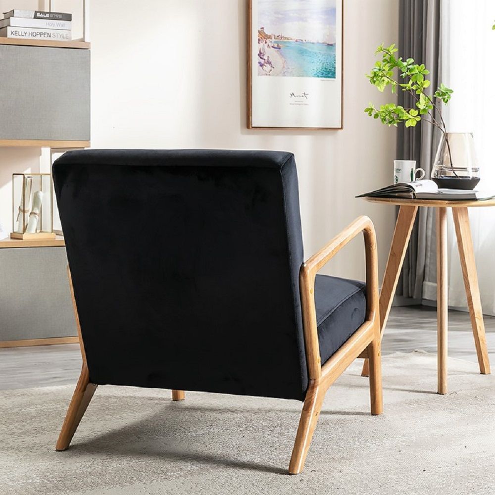 Classic mid-century modern open-framed wood arm chair with black cushioning on Tampa Home & Garden Store