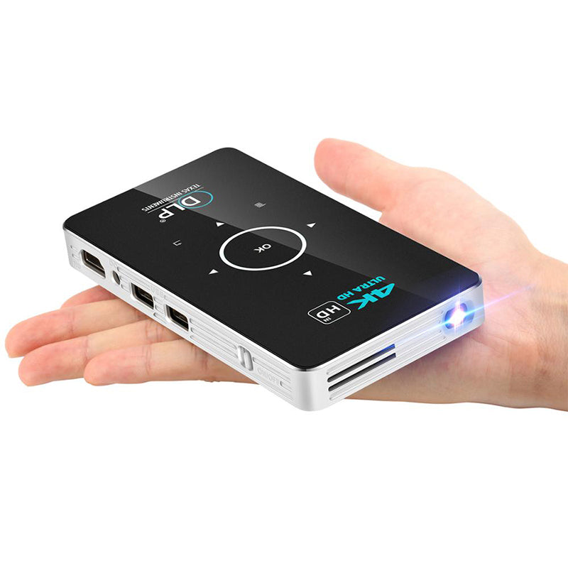Home wireless projector handheld with black top, white sides, circular nav pad and blue LED on Tampa Home & Garden Store