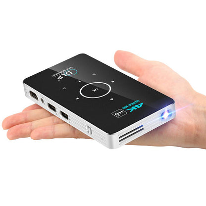 Home wireless projector handheld with black top, white sides, circular nav pad and blue LED on Tampa Home & Garden Store