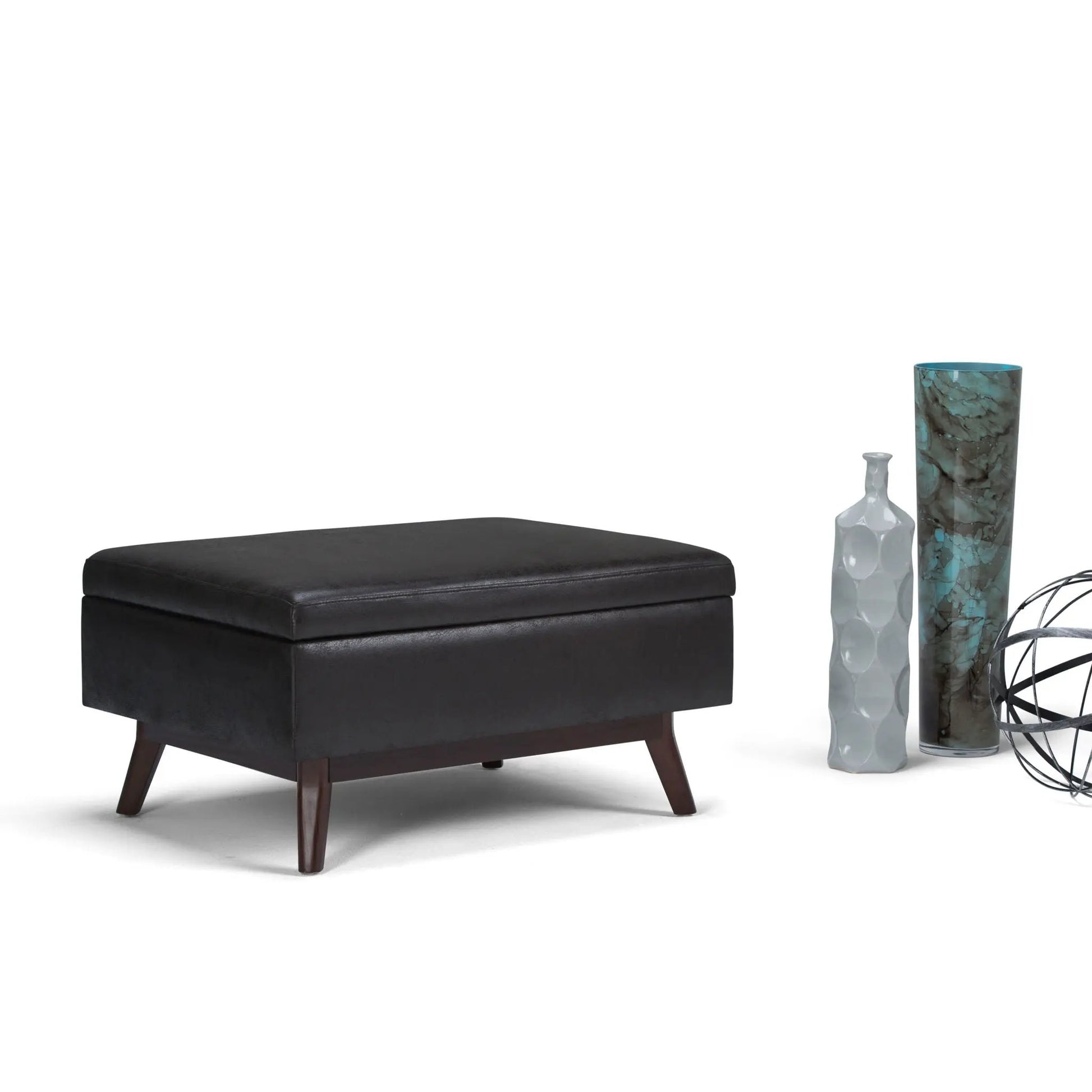 Owen upholstered rectangular storage ottoman in black with dark wood legs on Tampa Home & Garden Store