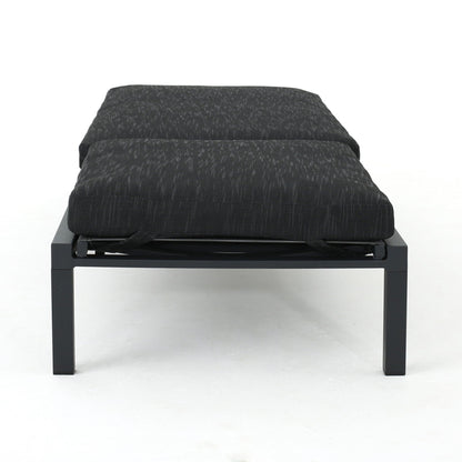 Modern chaise lounge with dark gray water-resistant fabric cushions on a black metal frame on Tampa Home & Garden Store